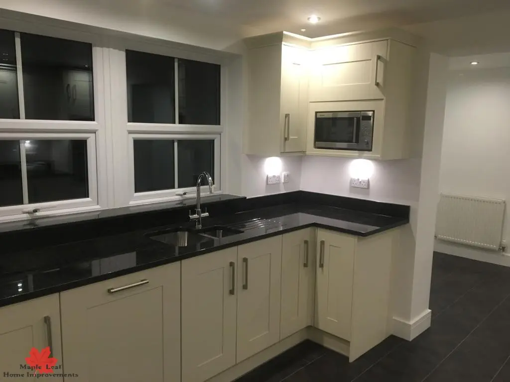 Cream shaker kitchen with range cooker
